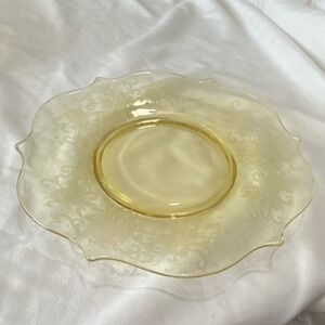 Yellow glass decorative plate with etched floral design, round glossy finish
